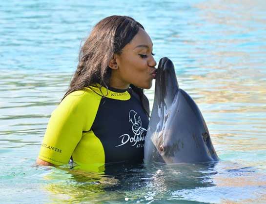 ebube-nwagbo-kissing-dolphin.jpg
