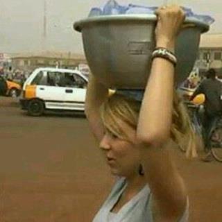 Funny Picture: White Woman Caught Hawking Sachet Water