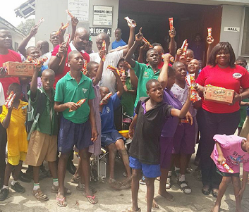 Harrysong Feeds Children with Down Syndrome