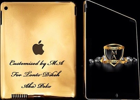 PICTURES: A Male Fans Surprises Nollywood Actress Tonto Dikeh With Ipad Made of 24 Carat Gold As A Gift