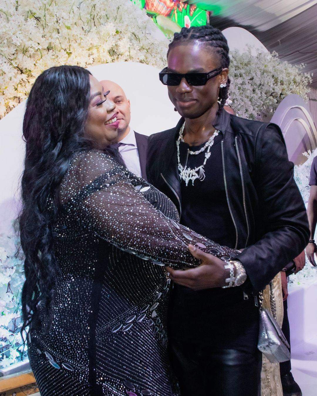 Singer Rema pictured with his mom at his homecoming event in his state, Edo.